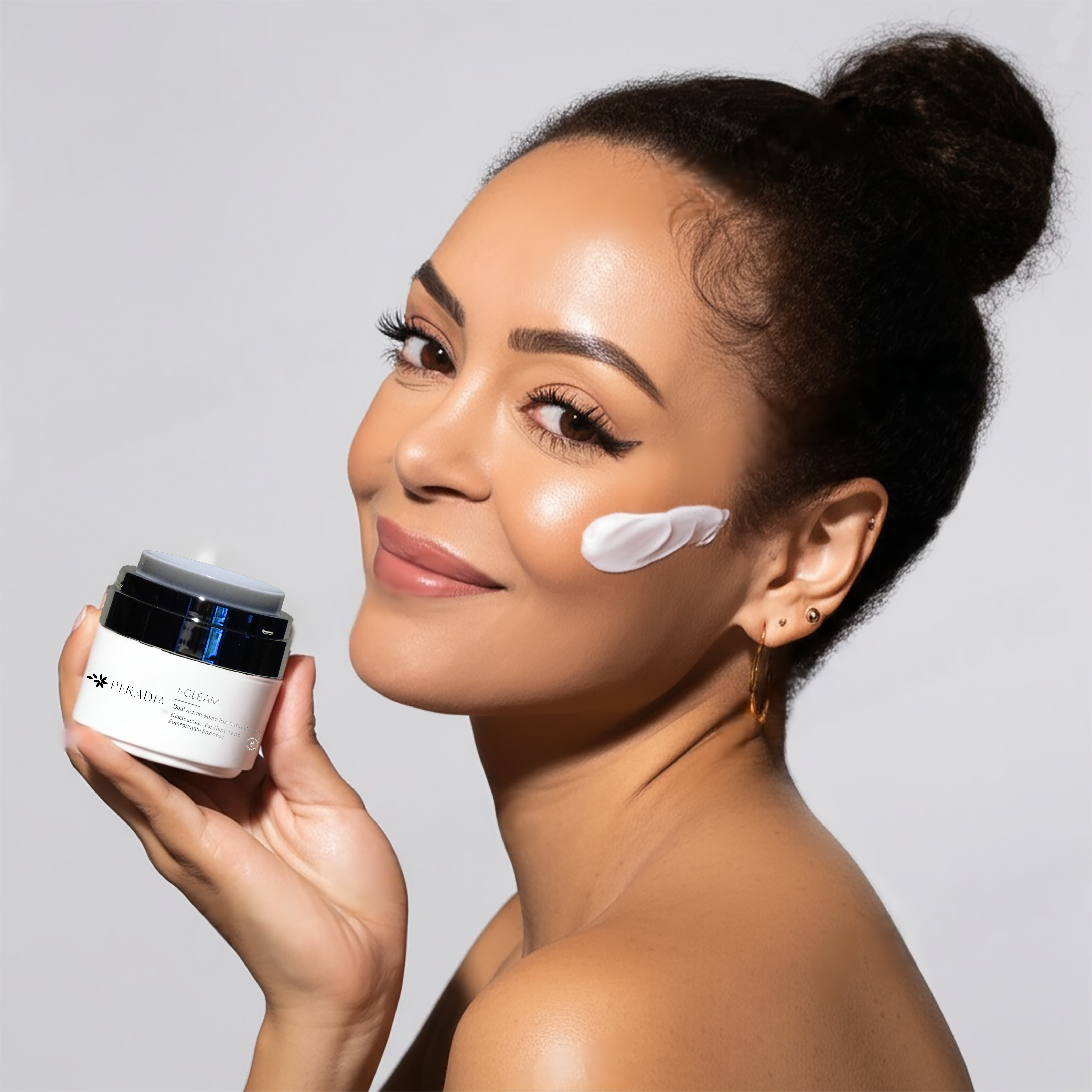 Woman applying Peradia's I-GLEAM microexfoliating cream to face satisfied with her results.